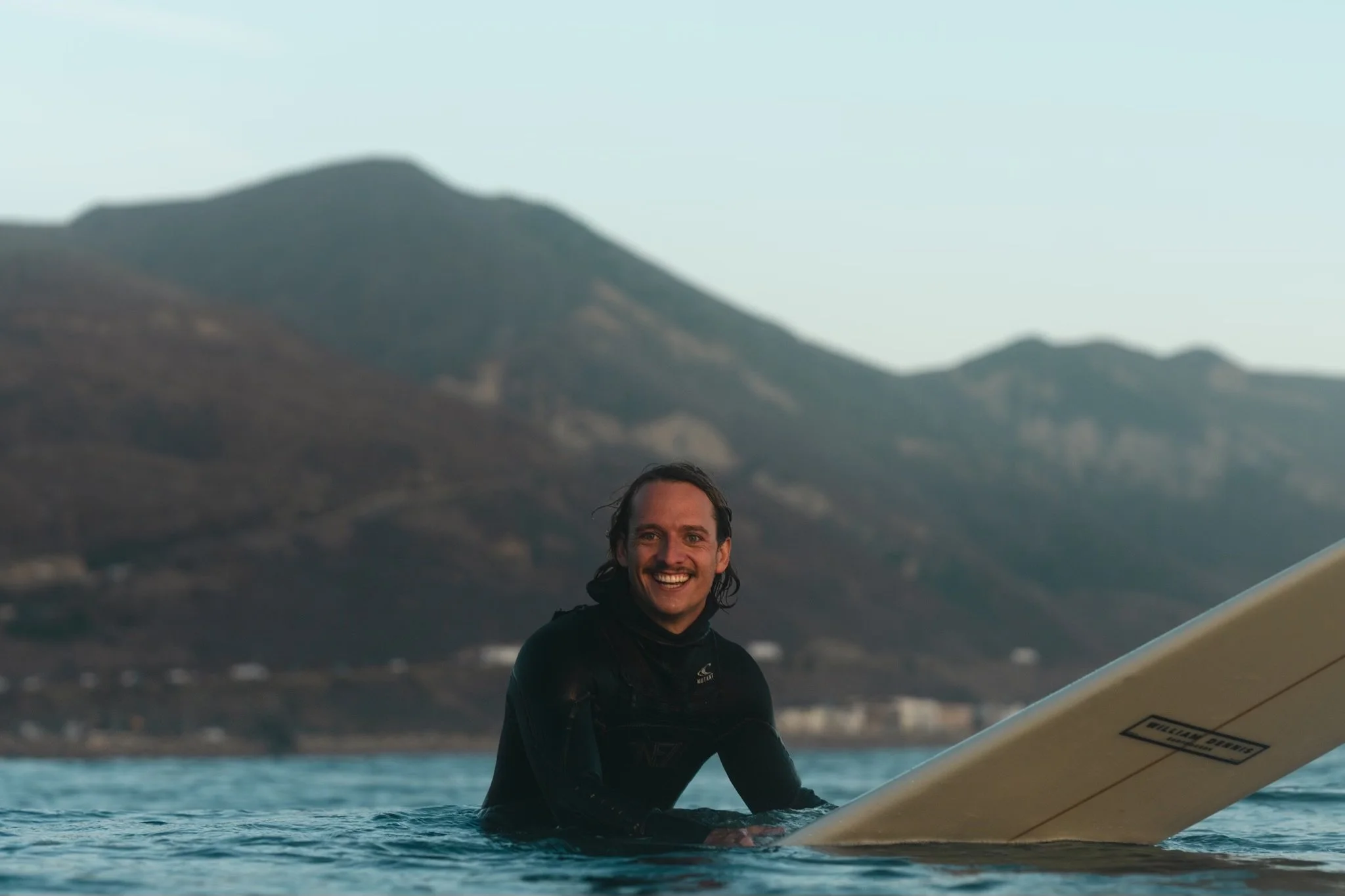 Roo surfing in california on a longboard waiting for a wave