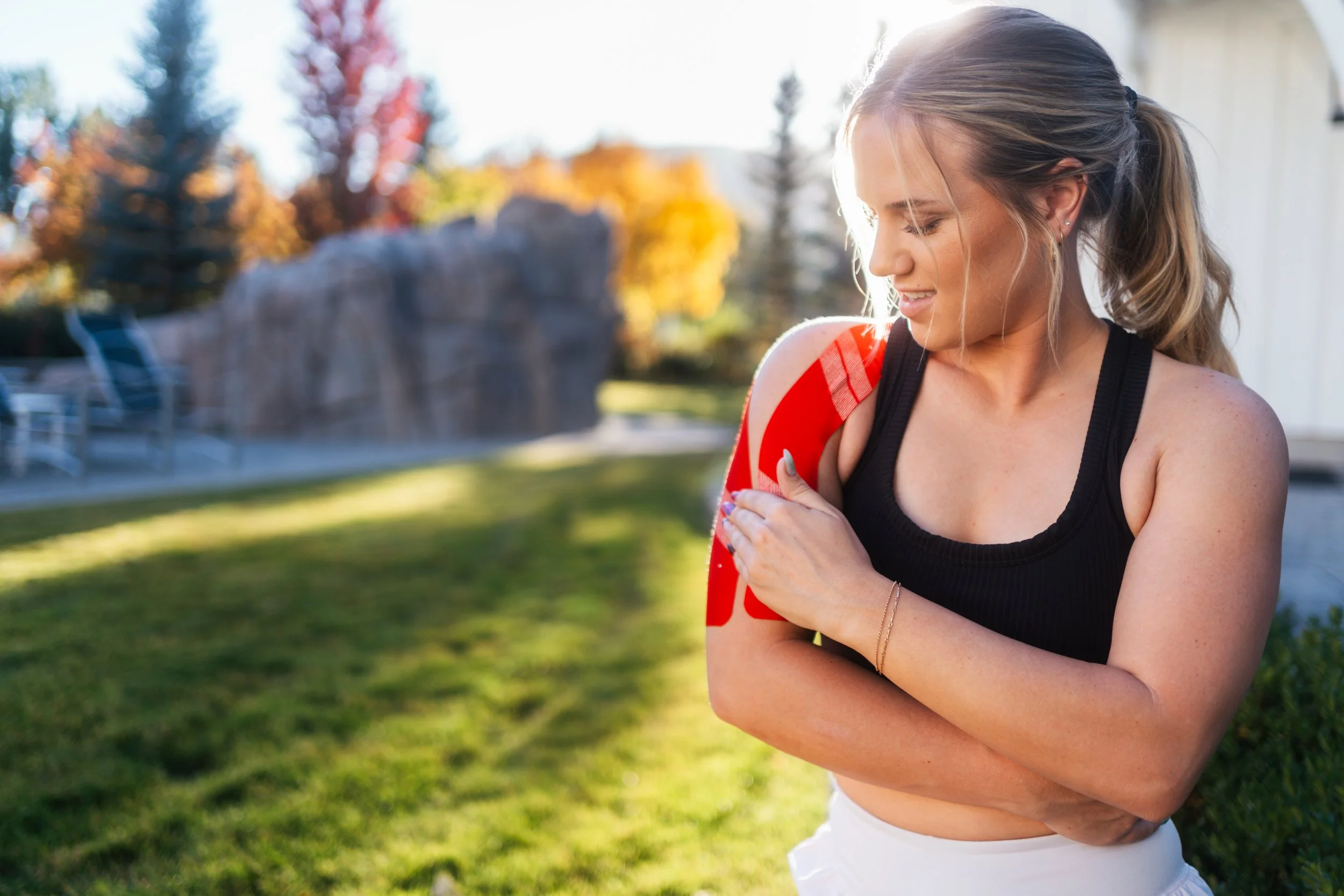 model posing with KT Tape on the shoulder