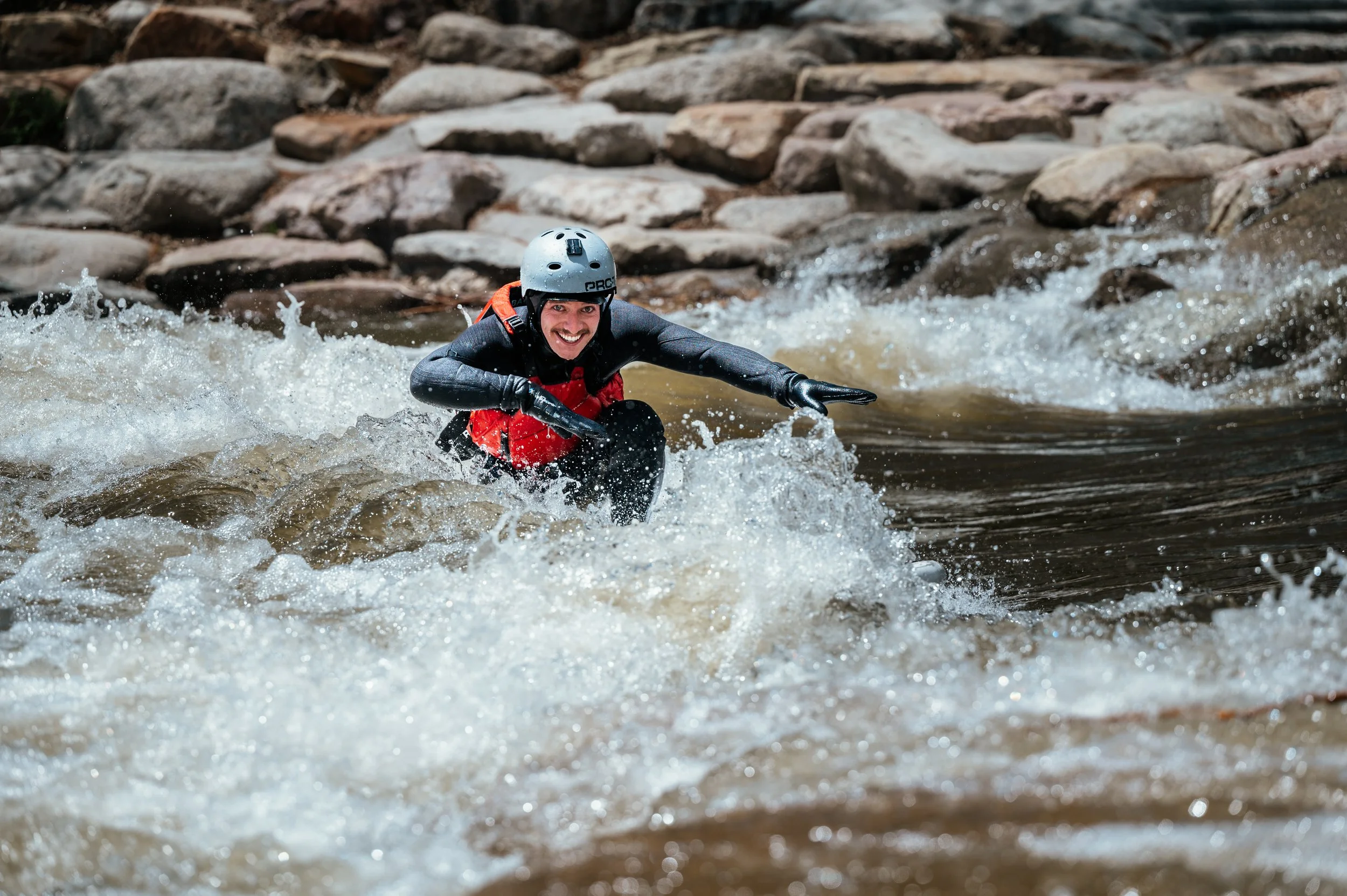 Roo Smith surfing and smiling in Salida