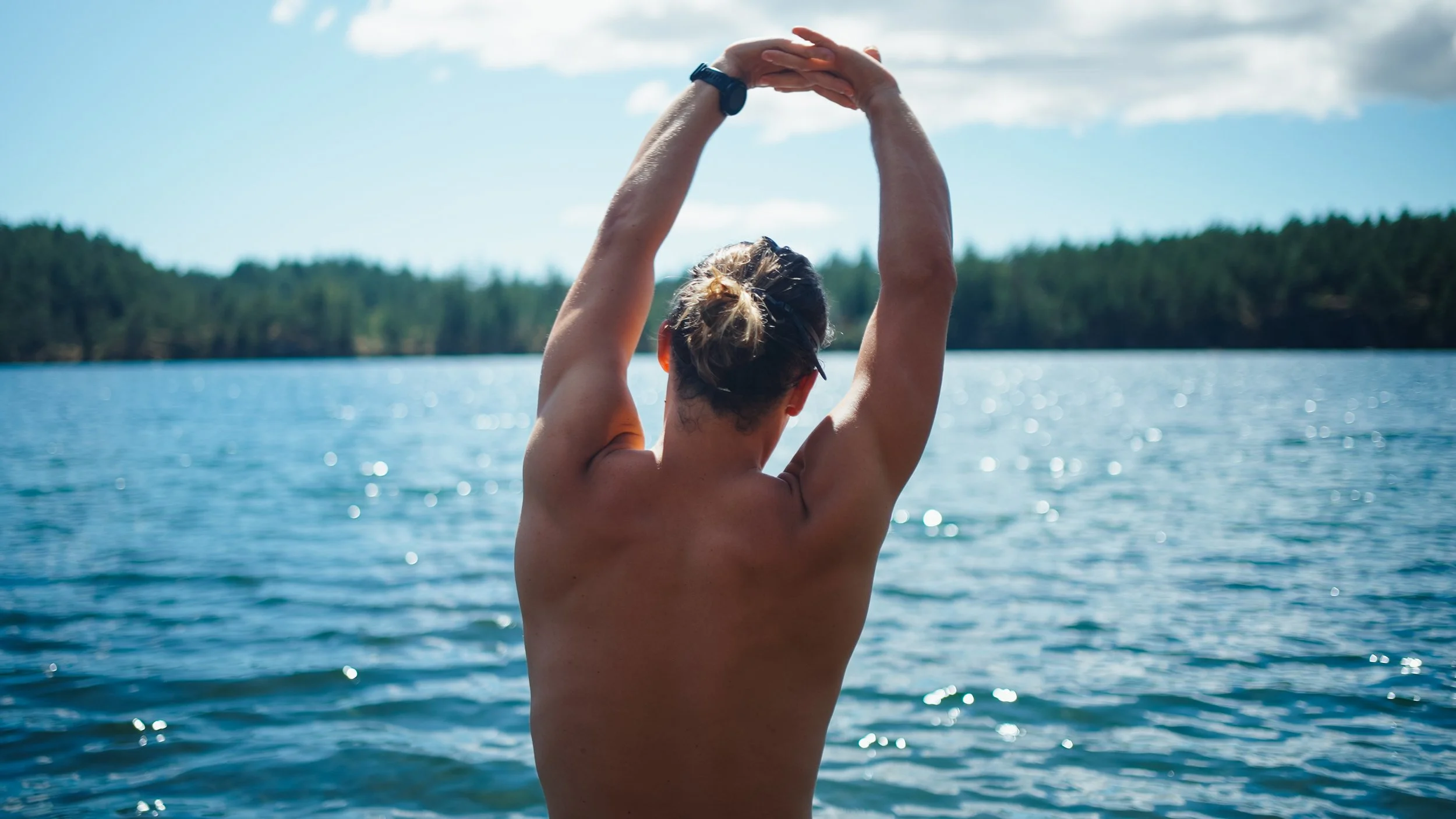 Roo smith stretching before swimming on Orcas Island
