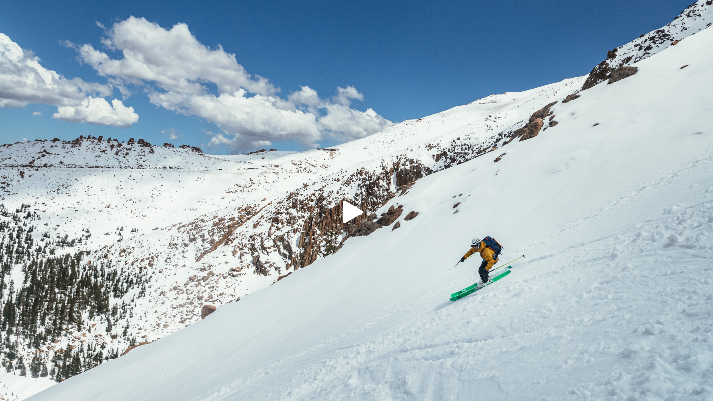 a skier descending a mountain