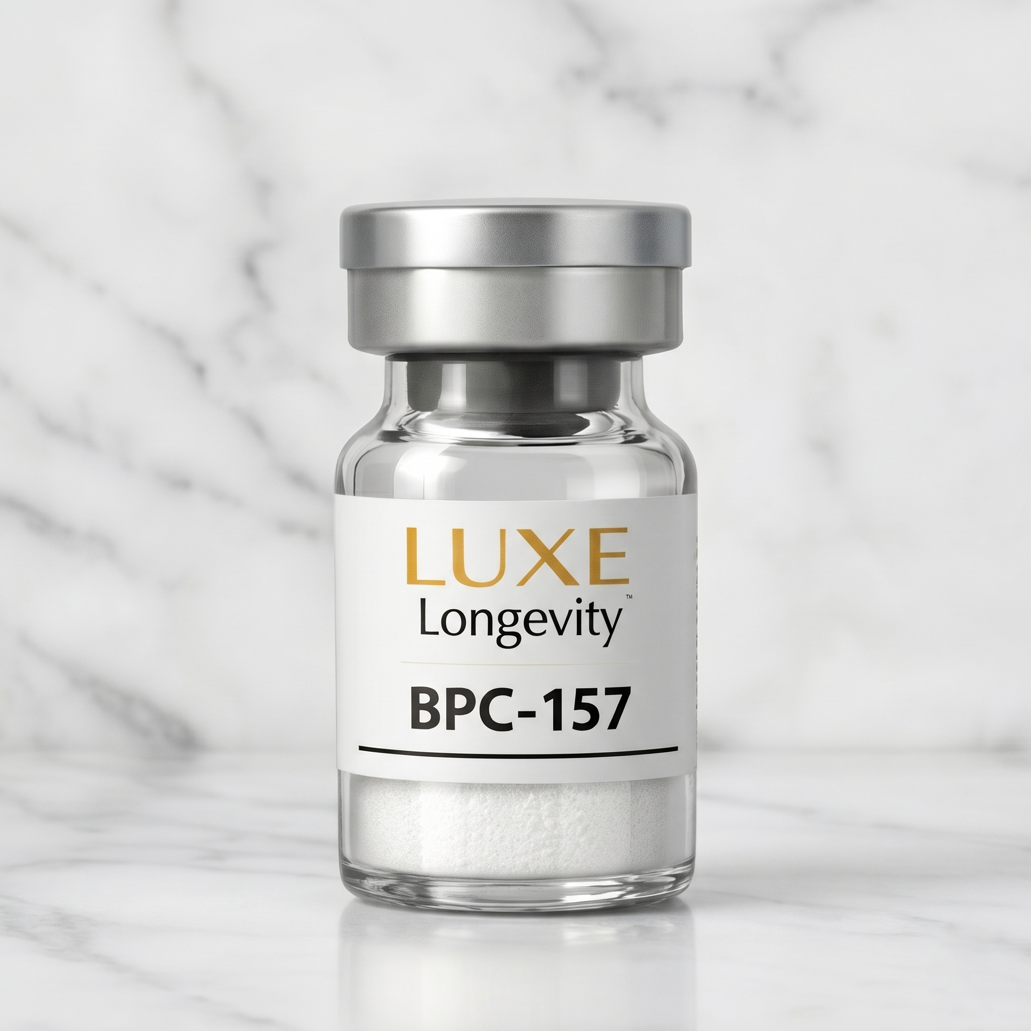 A small glass vial labeled 'LUXE Longevity BPC-157' with a silver cap, sitting on a white marble surface, against a white marble background.