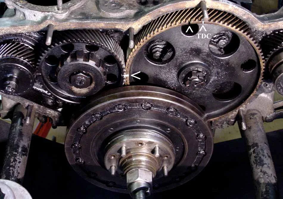 Photo 5:  Very accurate and carefully tested (TDC) marks on the timing gear, idler gear, and the relationship of the cover stud help to assure correct re-assembly.
