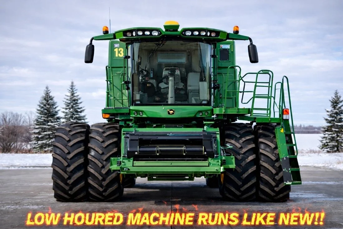 A large green John Deere agricultural machine with huge tires, set against a snowy landscape with trees. The text at the bottom reads 'LOW HOURDED MACHINE RUNS LIKE NEW!!' in orange and yellow.