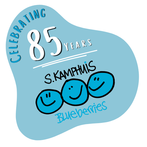 Celebrating 85 years of blueberries with three smiling blueberry characters and the signature of S. Kamphaus.