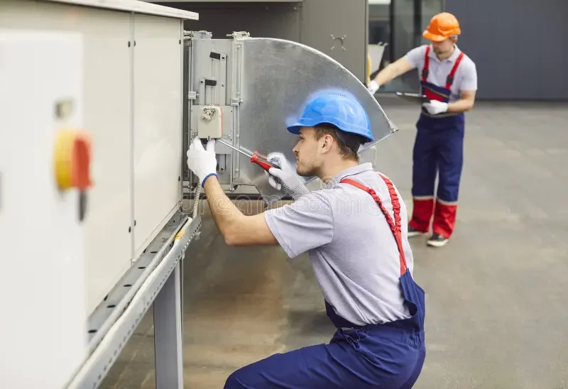 Oranssi technician working on a roof project