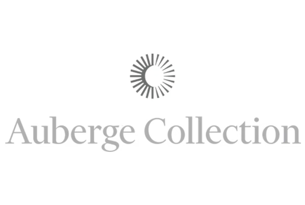 Logo for Auberge Collection with a circular design above the text.
