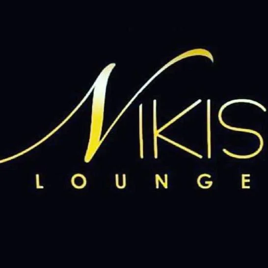 Logo for Nikki's Lounge with a black background, gold and white stylized text.