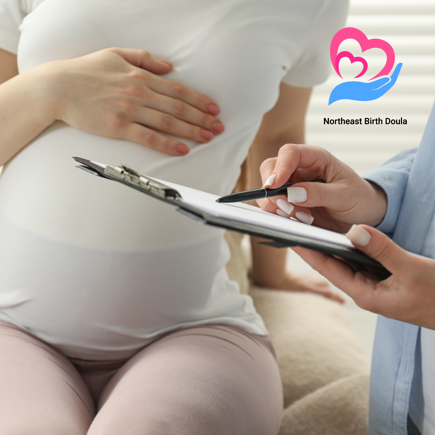 Pregnant lady image sitting on couch receiving support from a birth doula