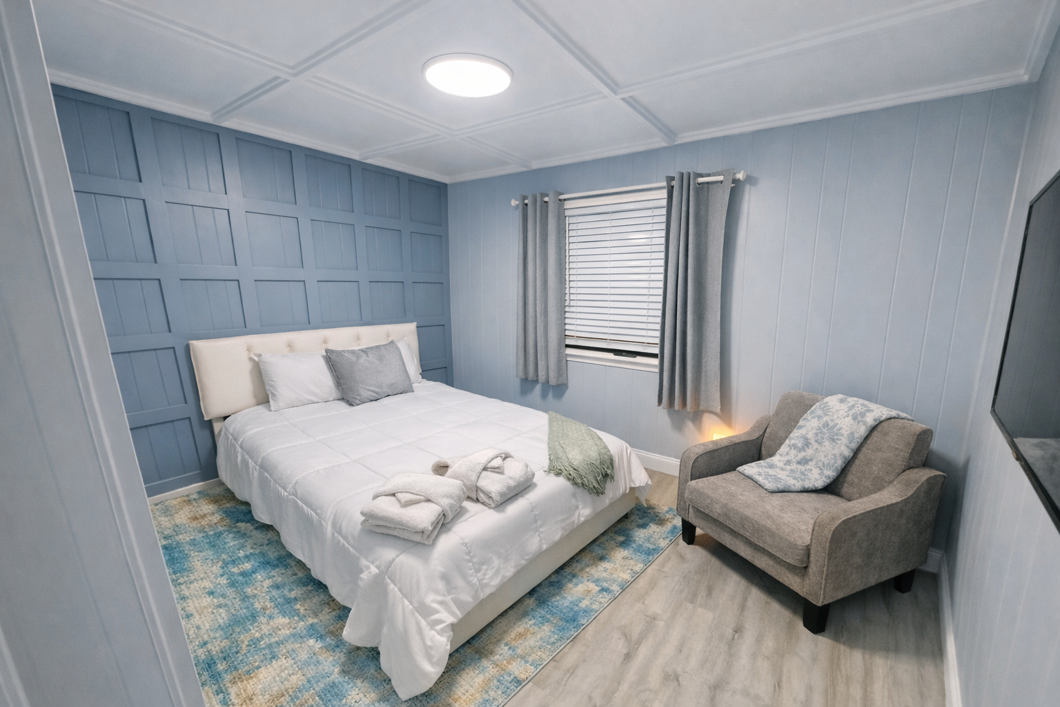 Serene modern bedroom with cozy accents.png