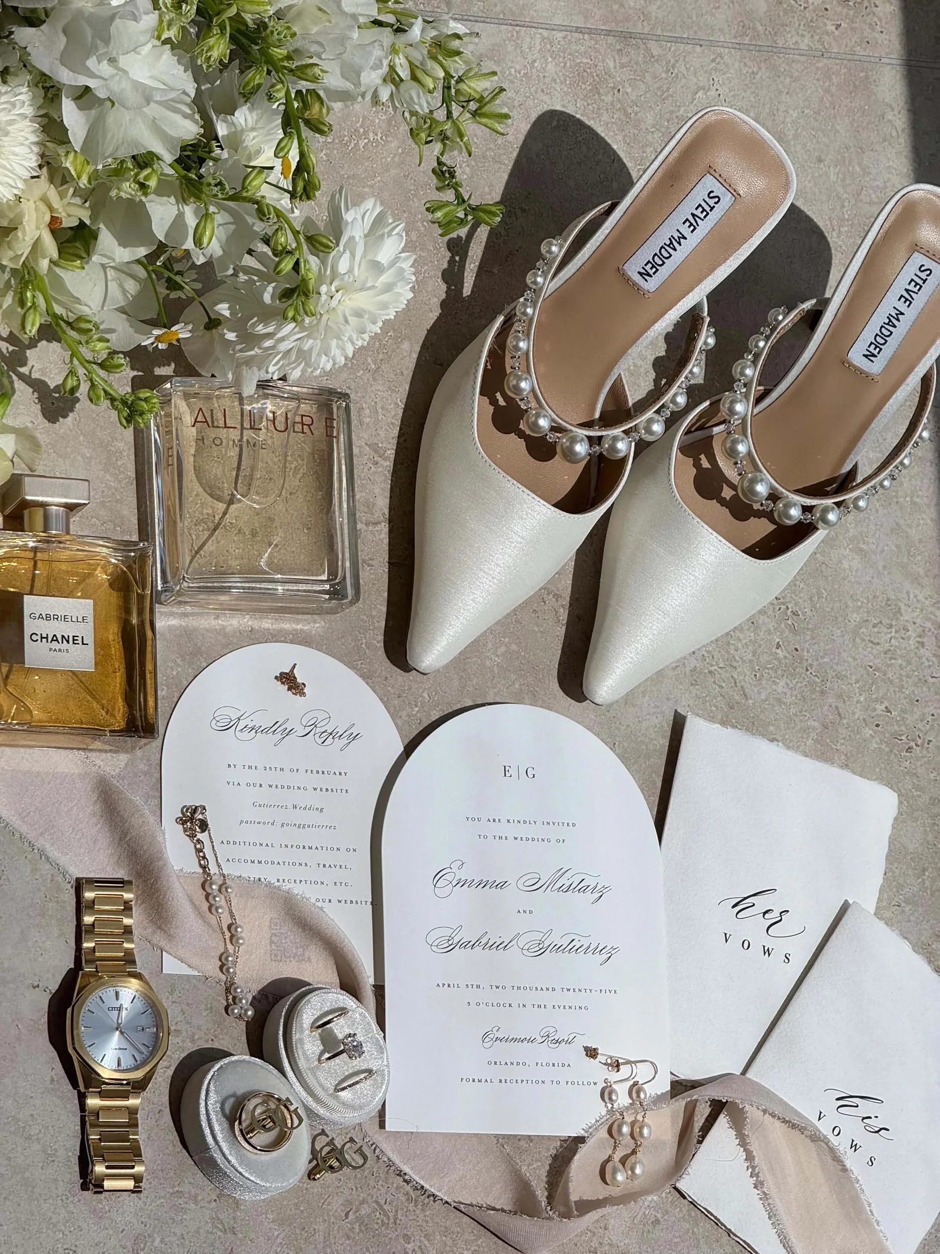 wedding invitation with bride's shoes and jewelry