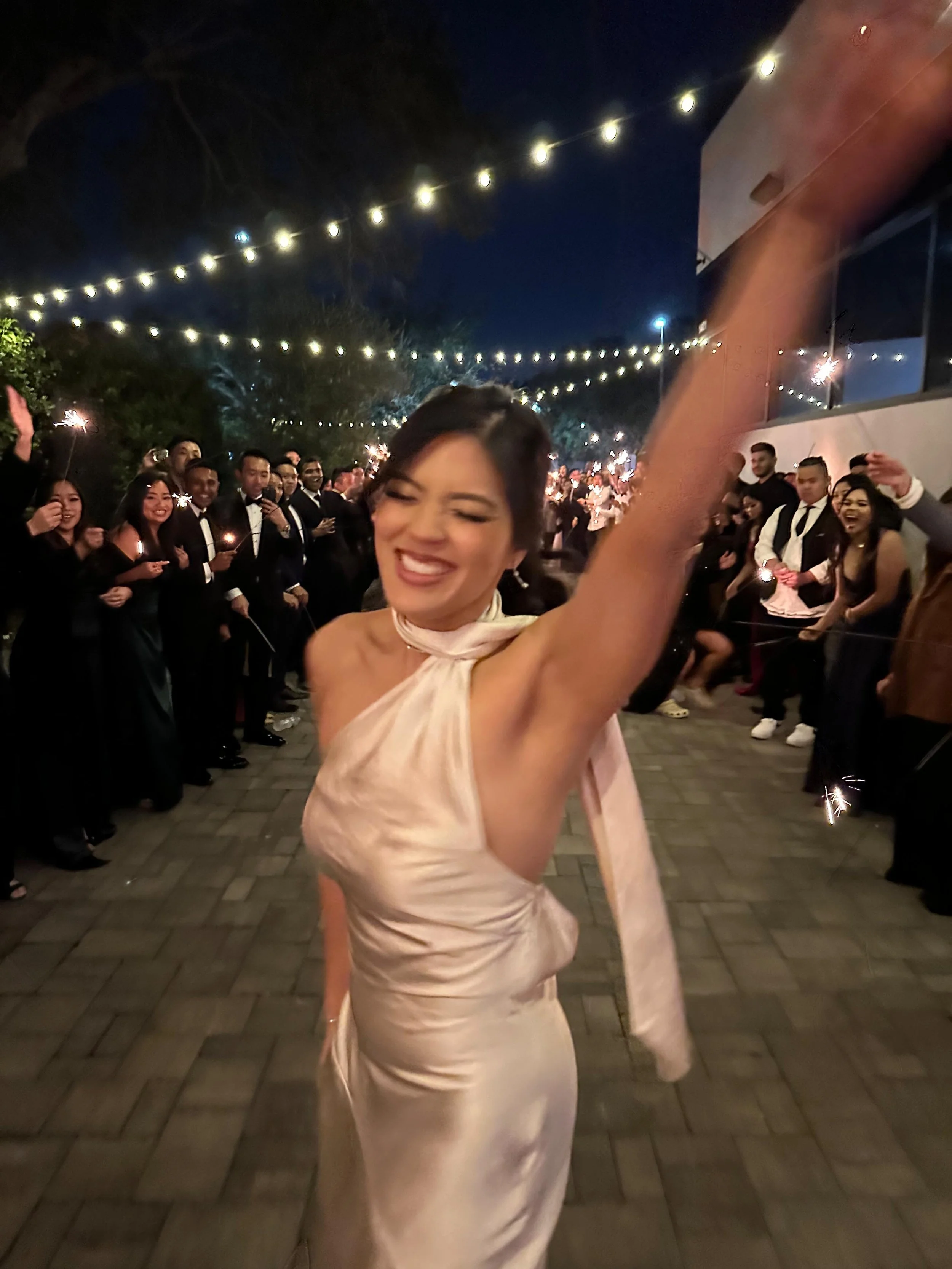 bride smiling in the middle of the dance floor