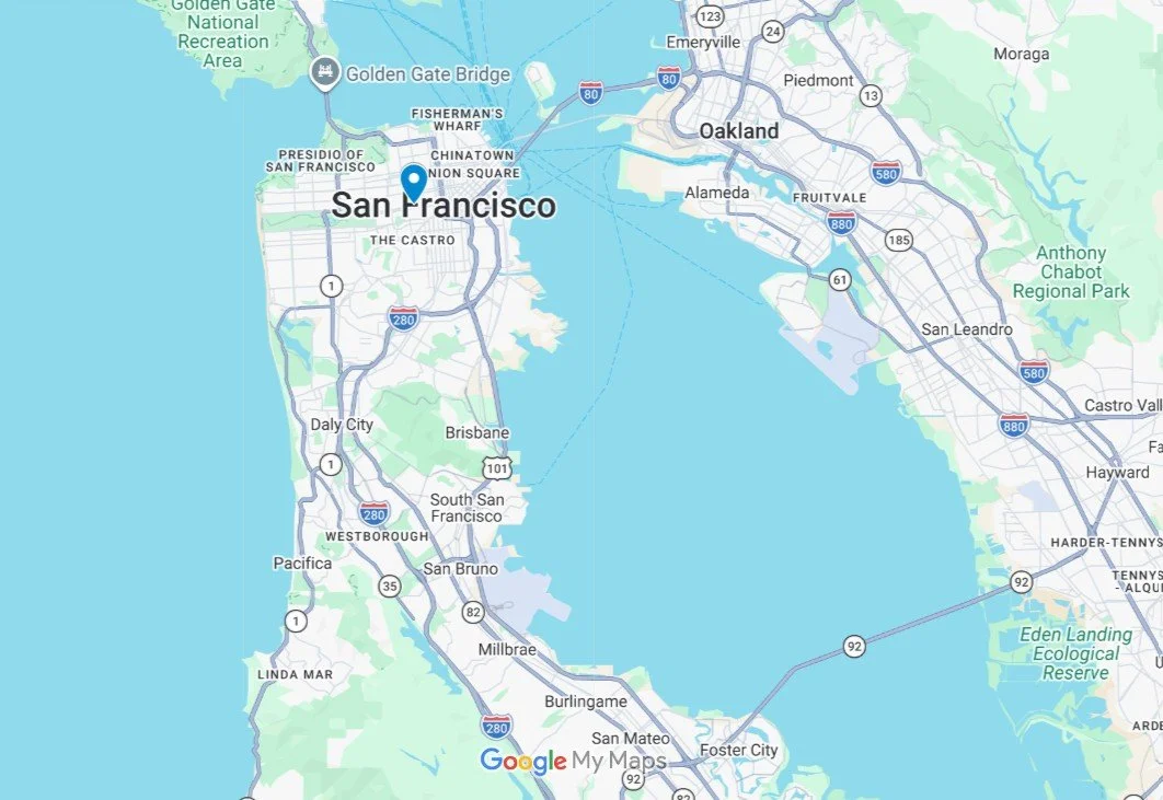 Map showing San Francisco and Oakland across the bay with labels for neighborhoods, highways, and landmarks in a typical map style.