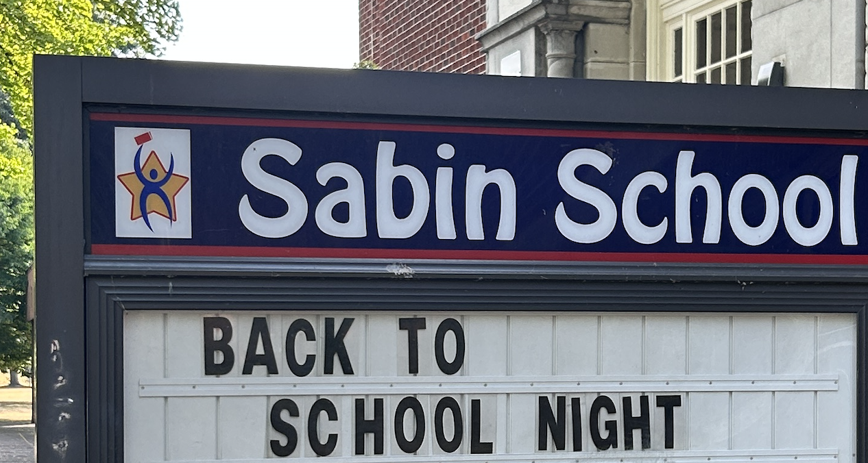Sign for Sabin School announcing 'Back to School Night'.