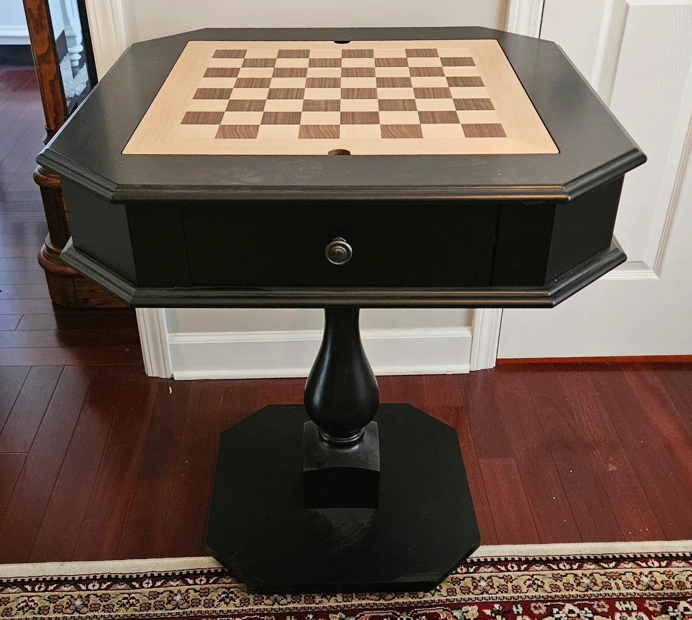 An end table with a chess board built into the top.