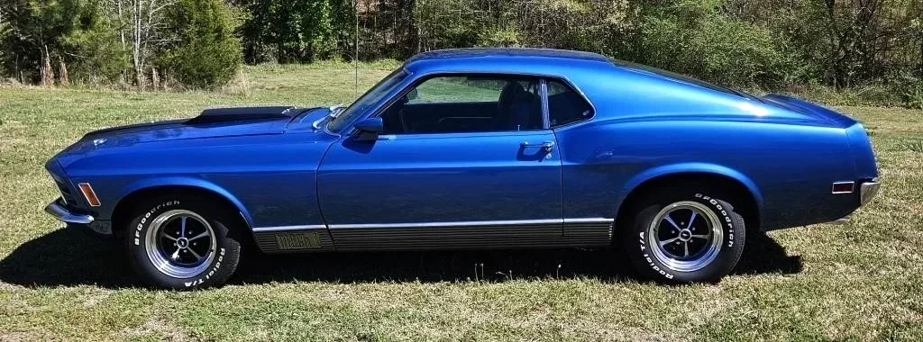 A blue 1970 Ford Mustang car.