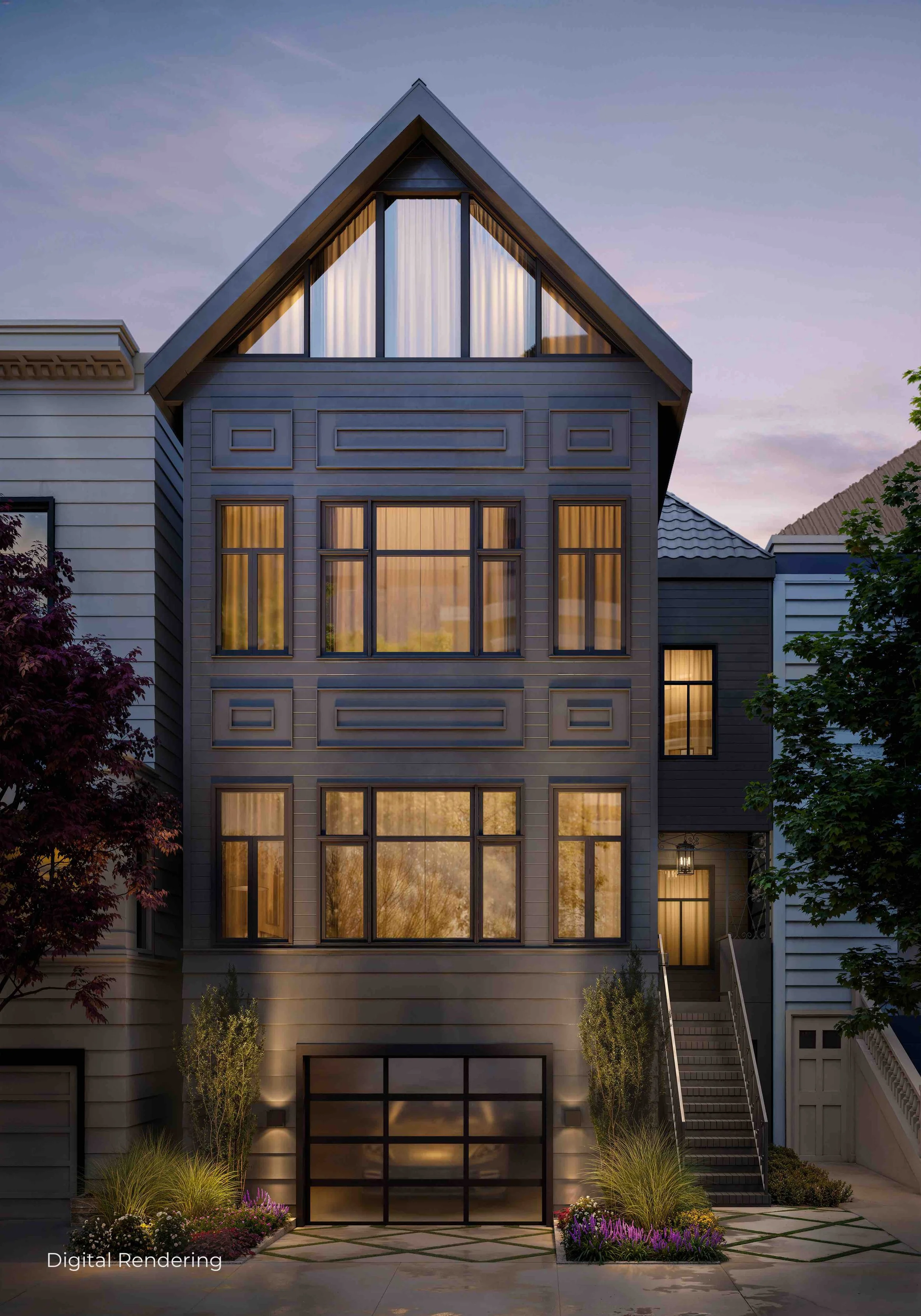 Modern multi-story house with large, illuminated windows, gray siding, and a peaked roof. Landscaping includes plants, trees, and outdoor lighting, with a driveway and steps leading up to the entrance.