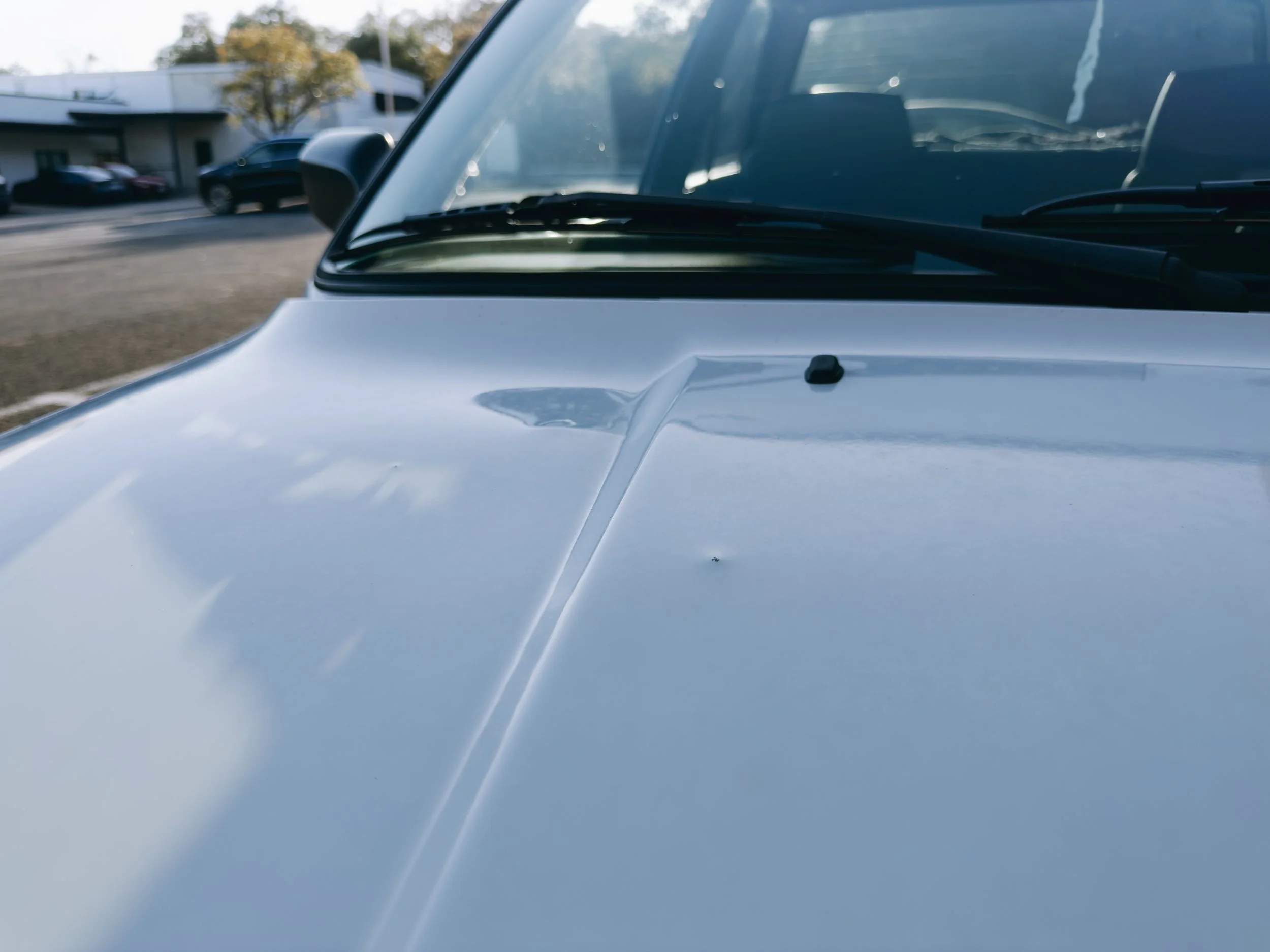 Passenger side of hood dents