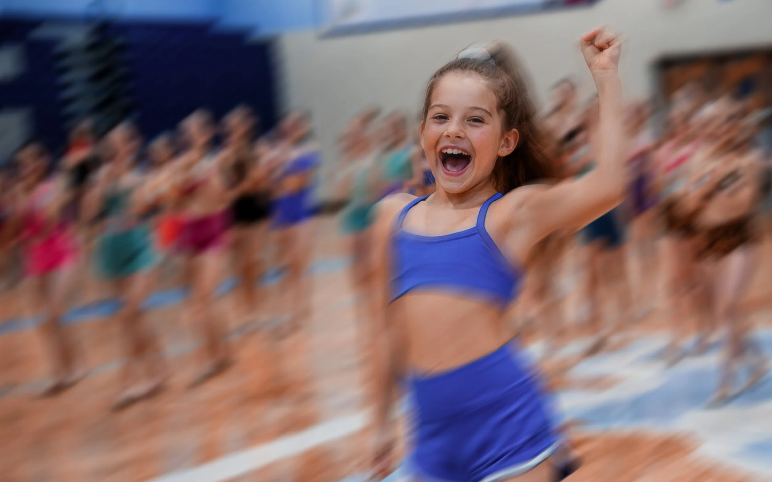 Child dancing at TRIBE 99 OFFSEASON event