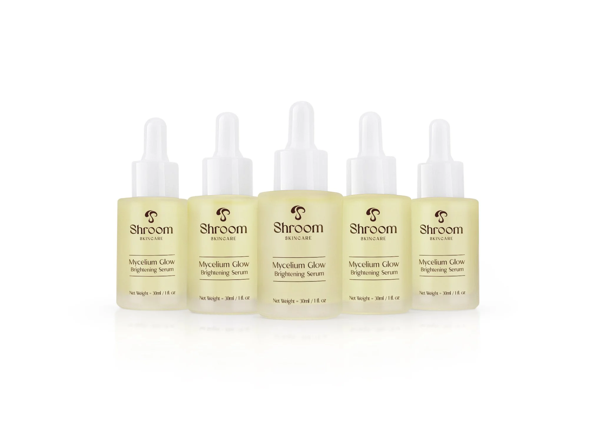 Five bottles of Shroom Skincare Mycelium Glow Brightening Serum arranged in a row with white background.