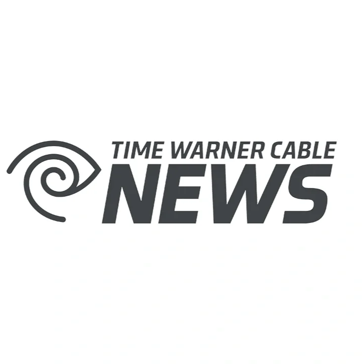 Time Warner Cable News logo with stylized eye and spiral design in black and white.