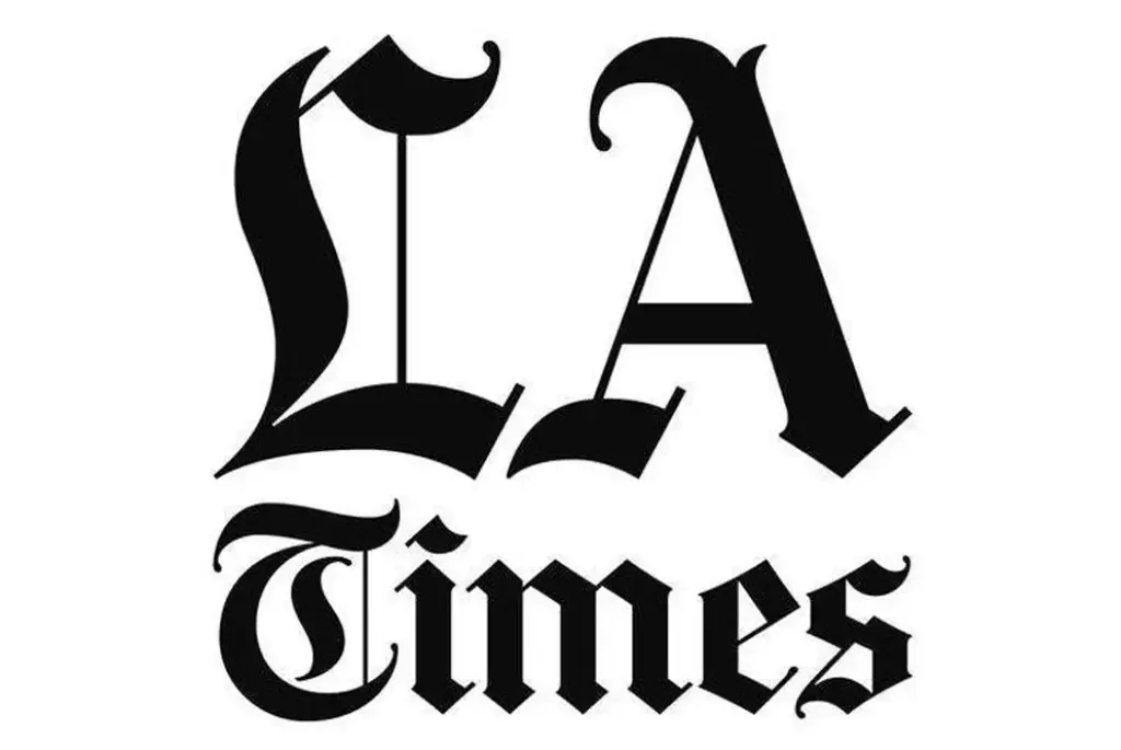 Stylized black and white lettering spelling 'La Times' in a decorative, gothic font.