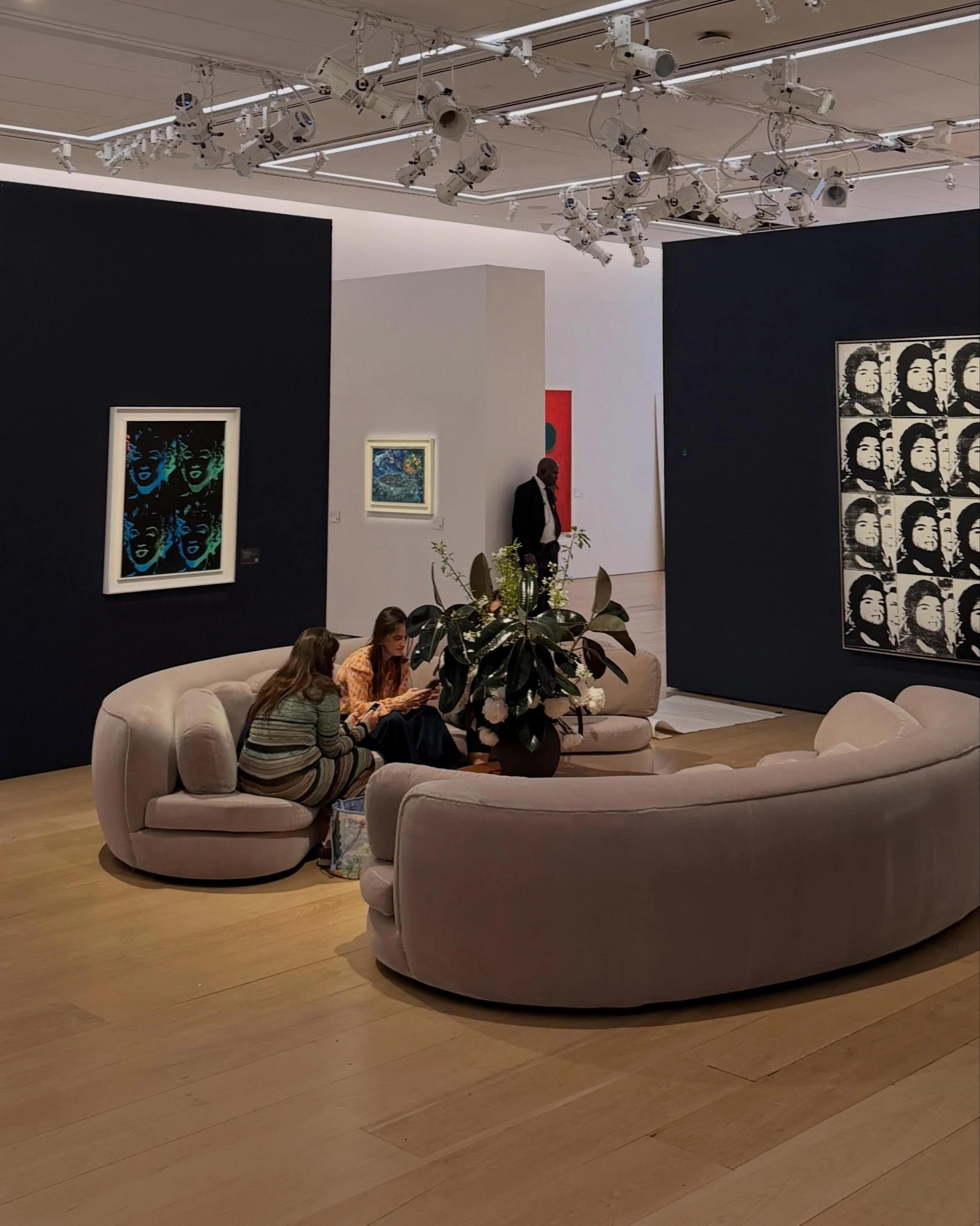 in front of Warhol&rsquo;s Sixteen Jackies.

peonies in ode to her favorite flower, with black leaves echoing the silkscreen&rsquo;s graphic contrast.