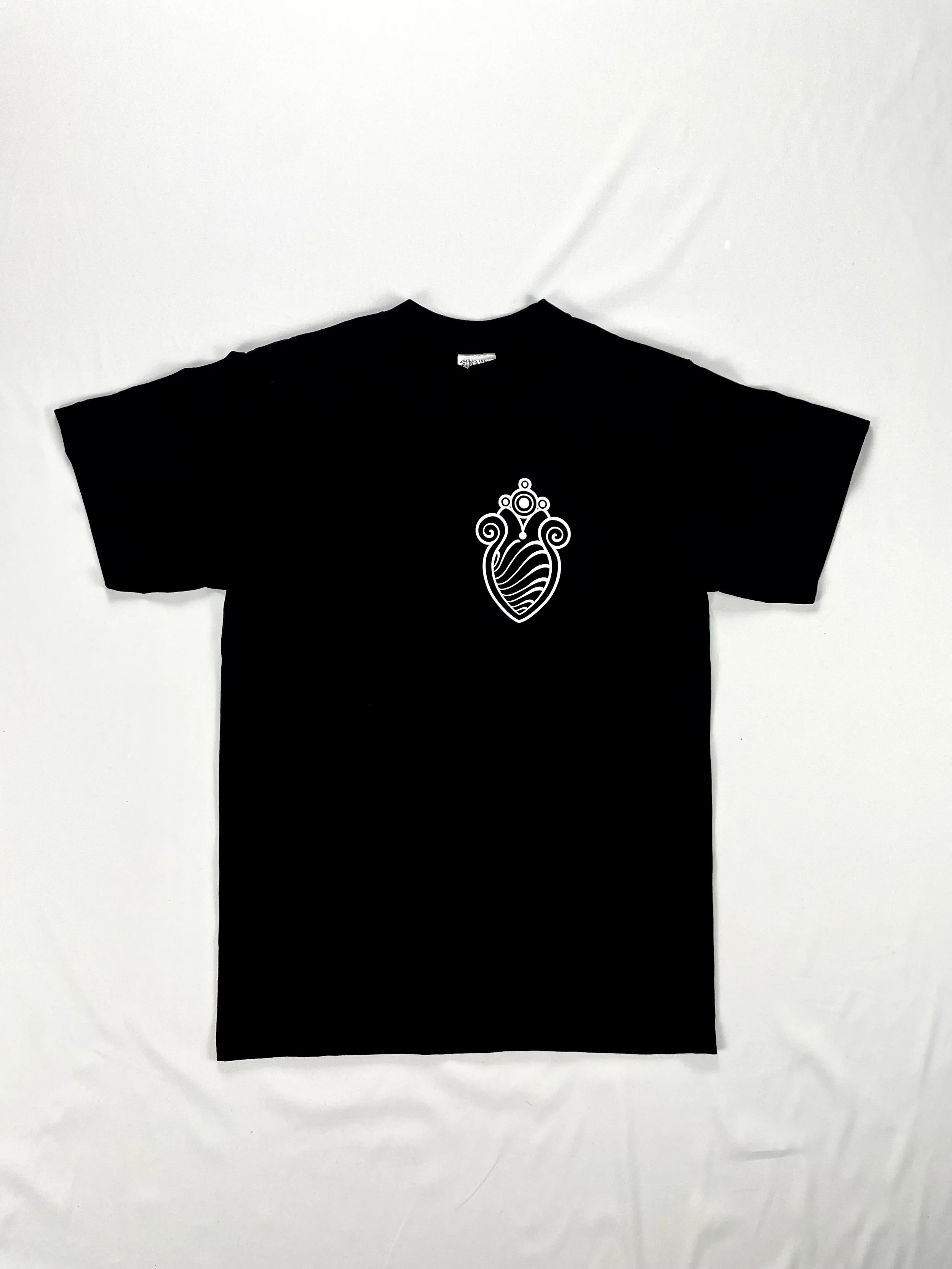 Black T-shirt with a white ornate decorative design on the front.