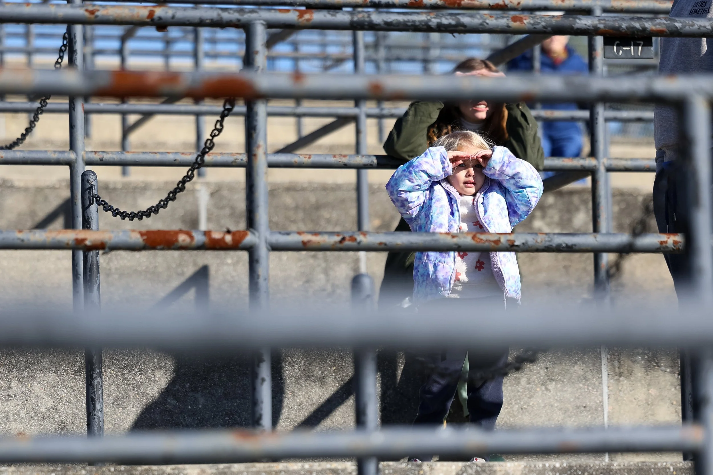 Lainey Moore, age 4, gazes at the horses during the Biscuits and Breezing event at the Springdale Race Course on Feb. 22, 2025. Camden natives, the Moore family, watched the preview of the 90th Carolina Cup for the first time. "We just saw that they 
