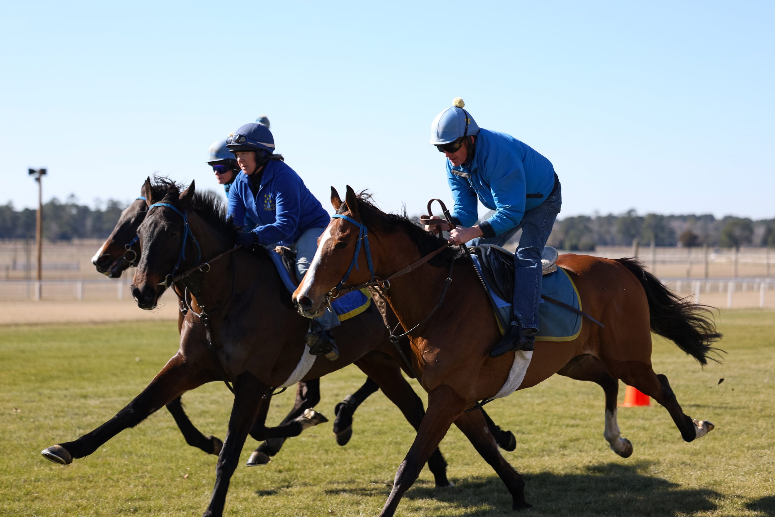 Exercise rider, Vicky Miller riding Mozu (left), Trainer Kate Dalton riding Snow Goose, and Jockey Bernie Dalton riding Inter Midnight during the Biscuits and Breezing event at the Springdale Race Course. The free family event hosted Feb. 22, 2025, p