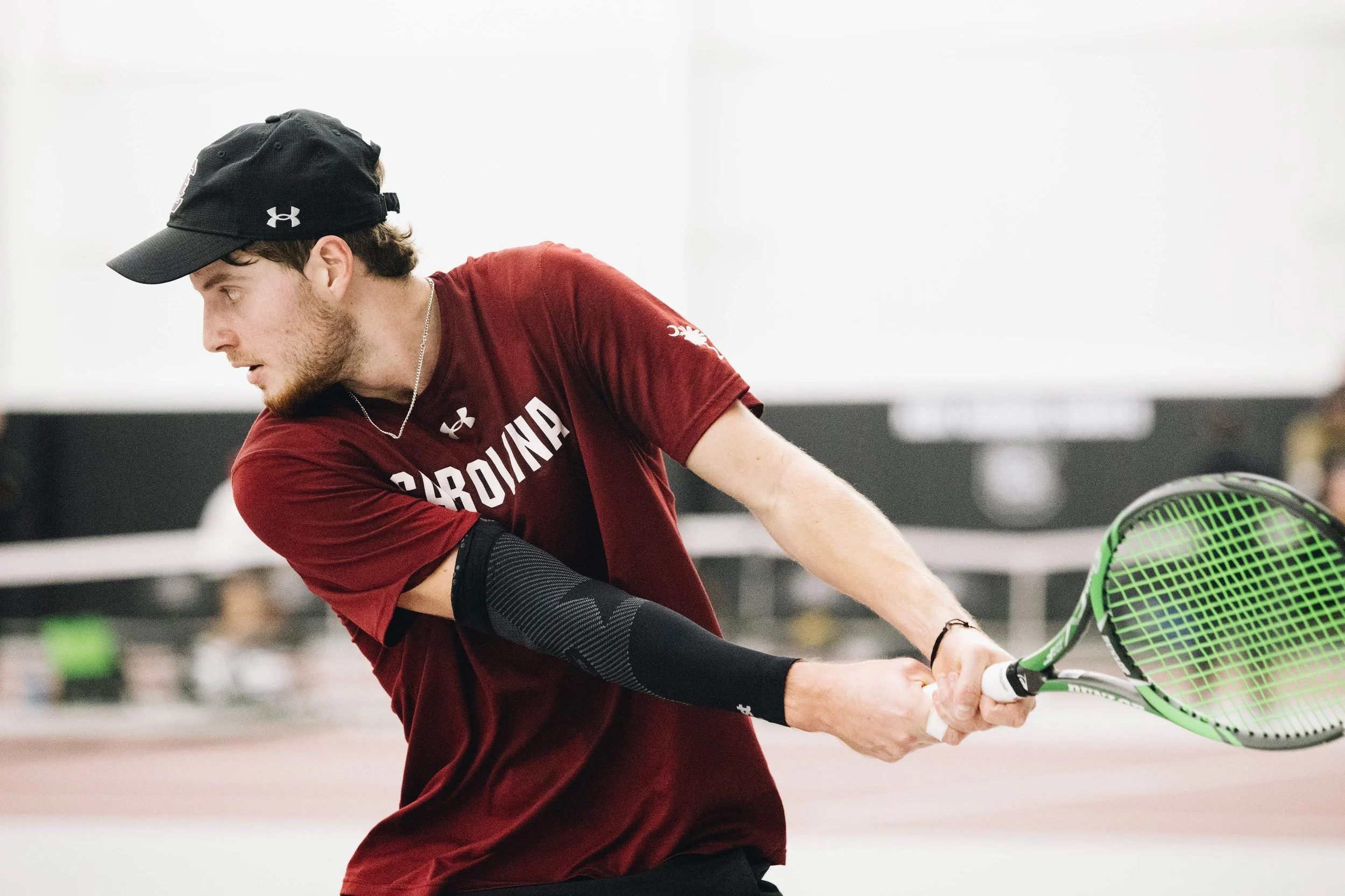 Senior Toby Samuel sets up for a powerful swing during South Carolina’s match against North Carolina State at the Carolina Indoor Tennis Center on Feb. 2, 2024. The Gamecocks lost the match 4-3.