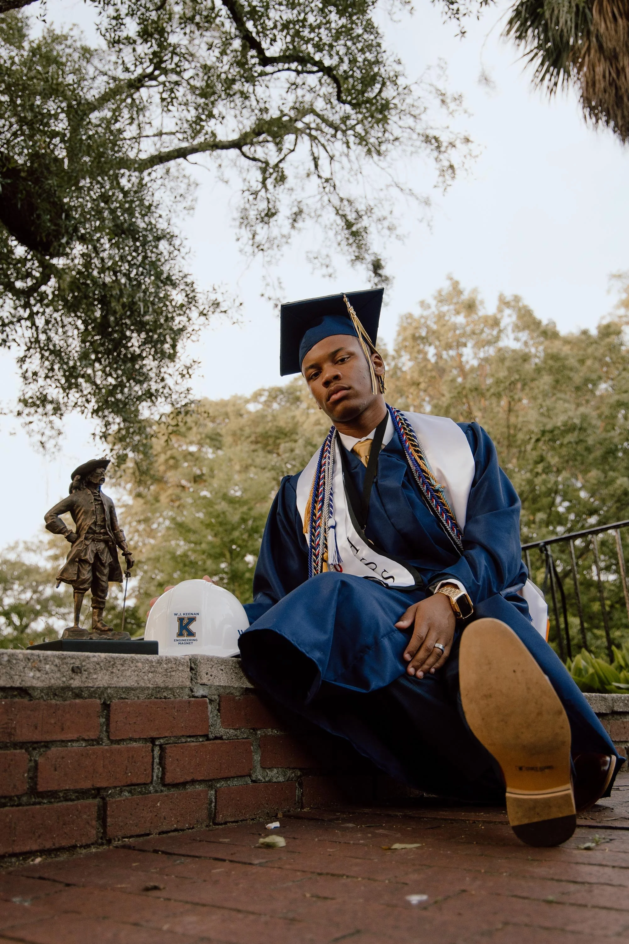 Armon Williams sits on the University of South Carolina Horseshoe in Columbia, South Carolina, on May 24, 2023,
for graduation portraits.