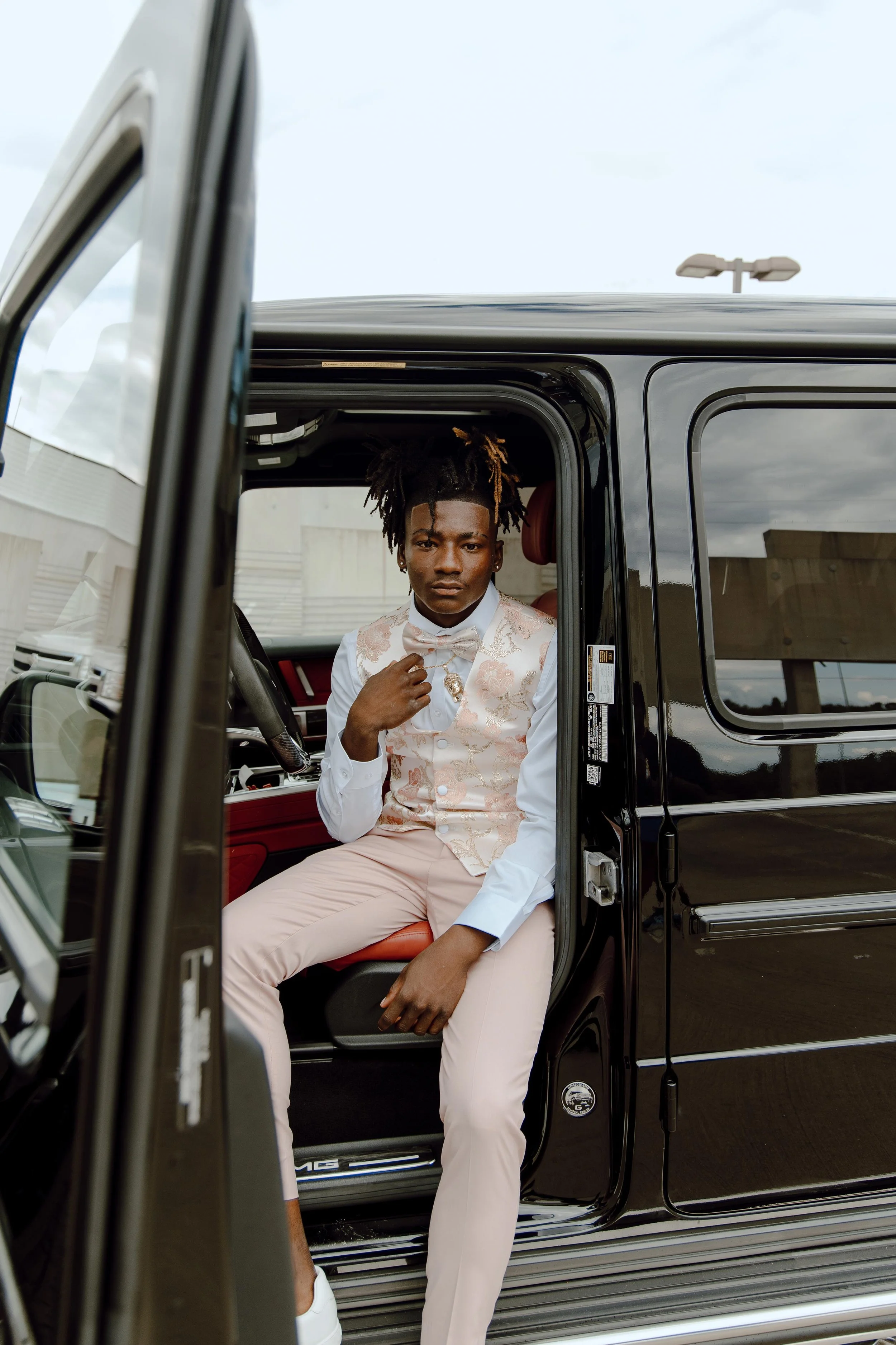 Adonis McDaniel takes portraits ahead of prom in a Main Street parking garage in Columbia, South Carolina, on May 6, 2023.