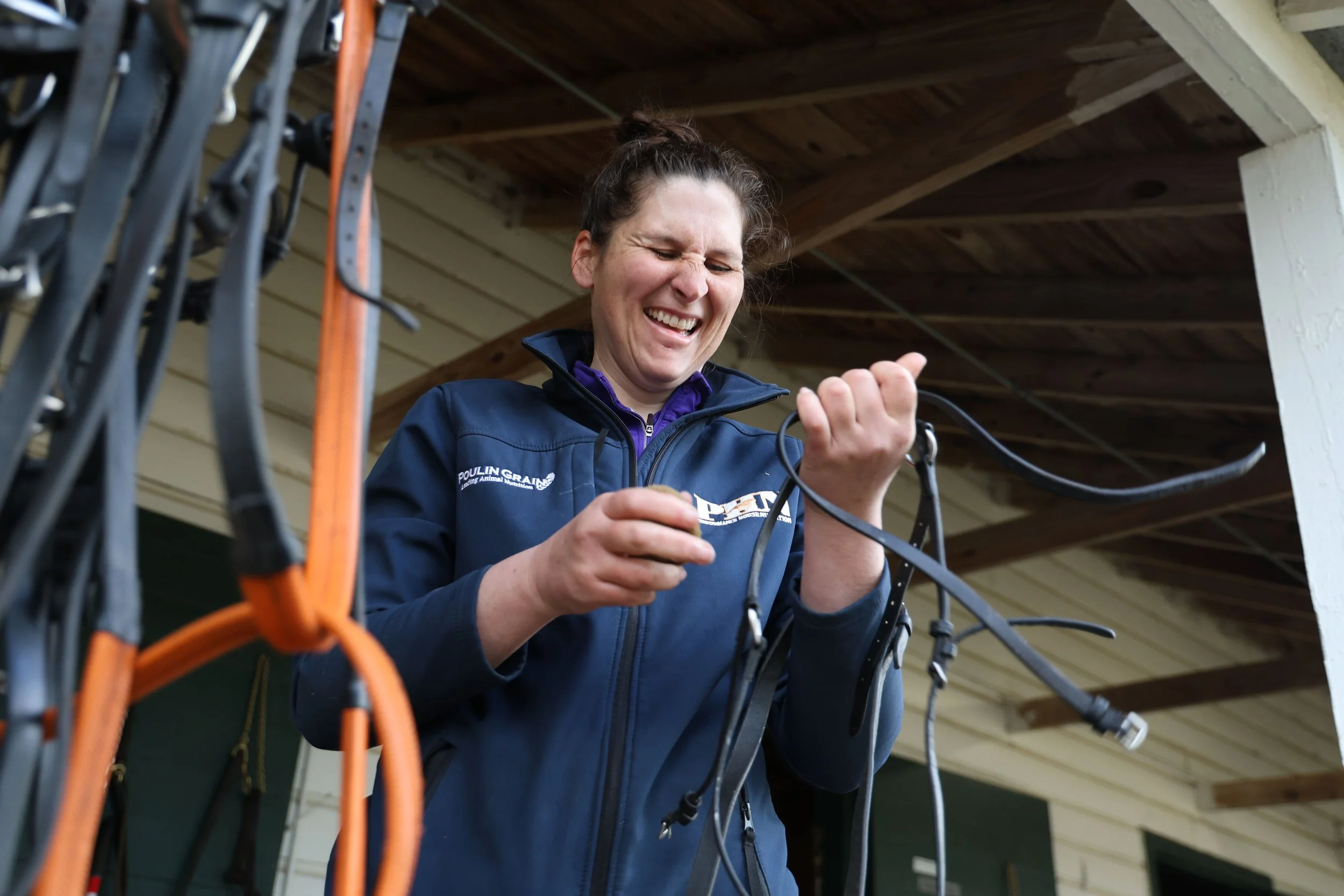 Jessica McCabe cleans bridal tack ahead of the Cup. During this process, she wipes away the dust and checks for cracks or rips in the leather. McCabe has worked with horses since she was 4 years old and says, “I can’t clean a house but I can clean so