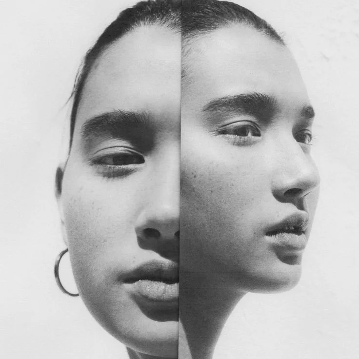 A split black and white portrait of a woman's face, showing a front view on the left and a side profile on the right.