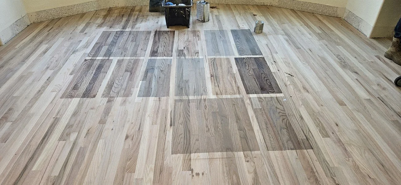 Stain color samples on hardwood floors for customer approval