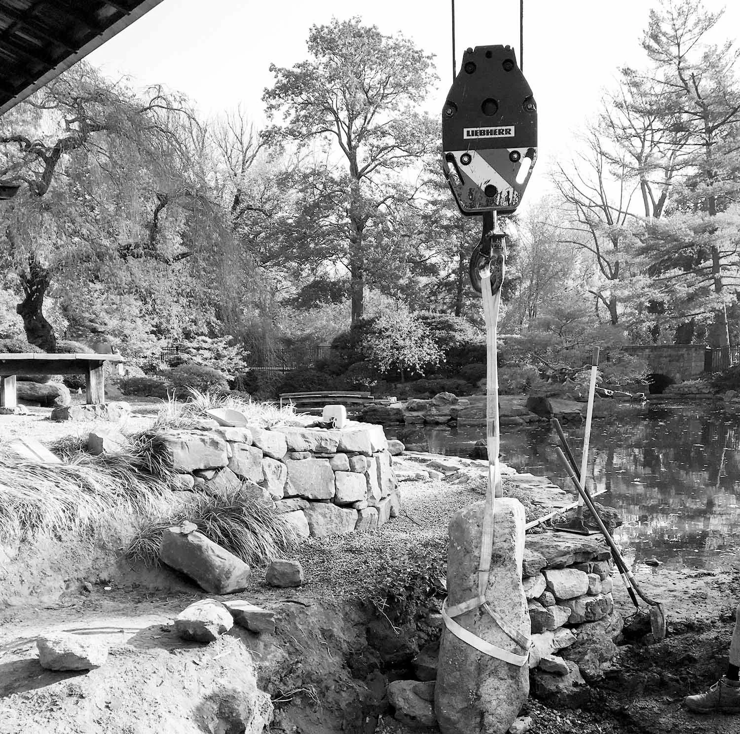 Rock setting in a Japanese Garden Stream using a crane in Philadelphia