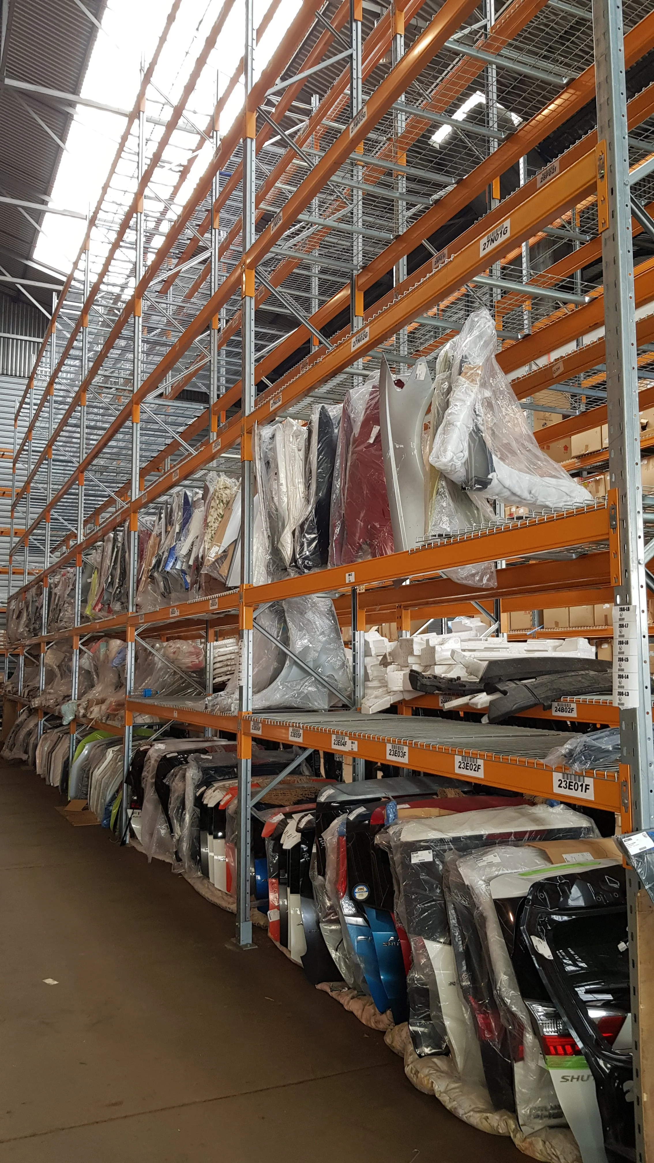 Shelves of car parts and accessories in a warehouse store.