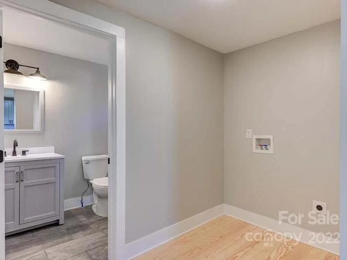 Laundry Room off of Kitchen hallway and common area bathroom