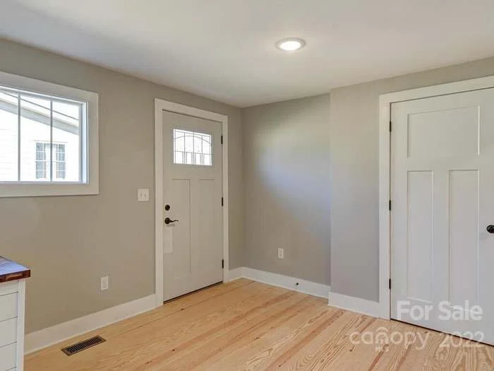 Dinning area back door and pantry closet view from kitchen 