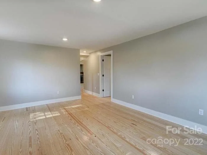 Hallway off of living room with bedroom #1  Master to the right  and bedroom #2 on the left down the hallway 
