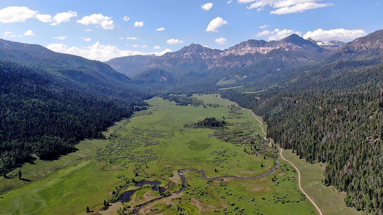 view of the weminuche valley from a drone