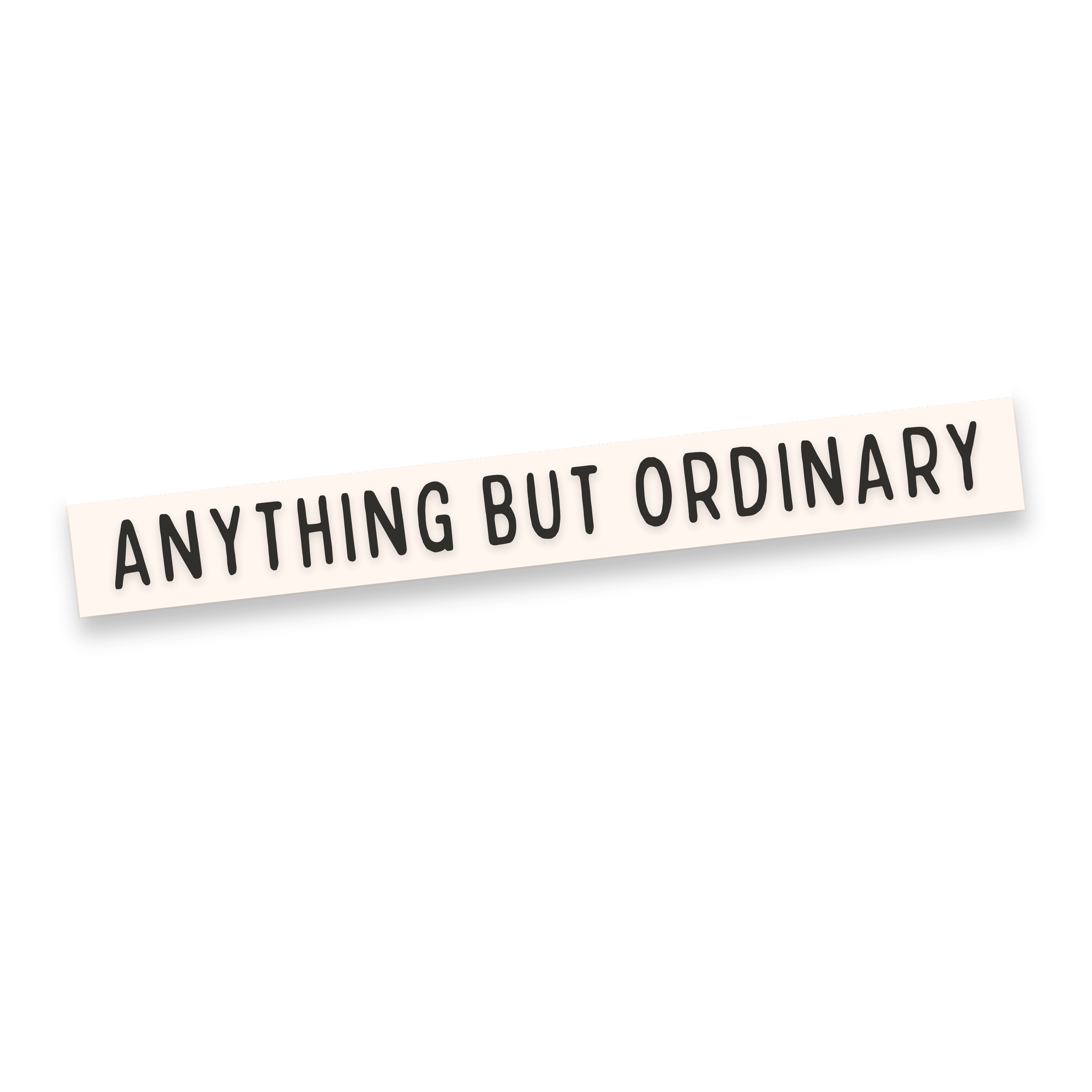 Part of a black sign with a white banner that has black text reading 'ANYTHING BUT ORDINARY' displayed at an angle.
