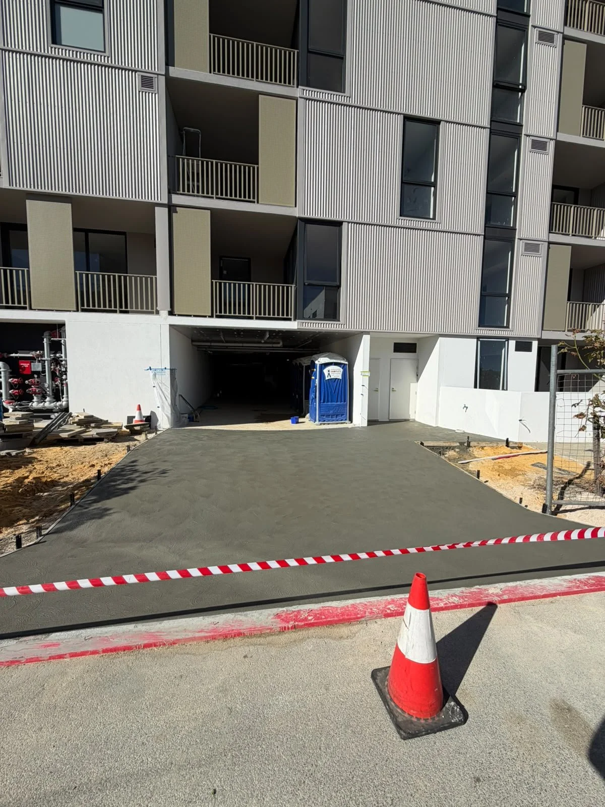 grey concrete finished pour in apartment site in north coogee