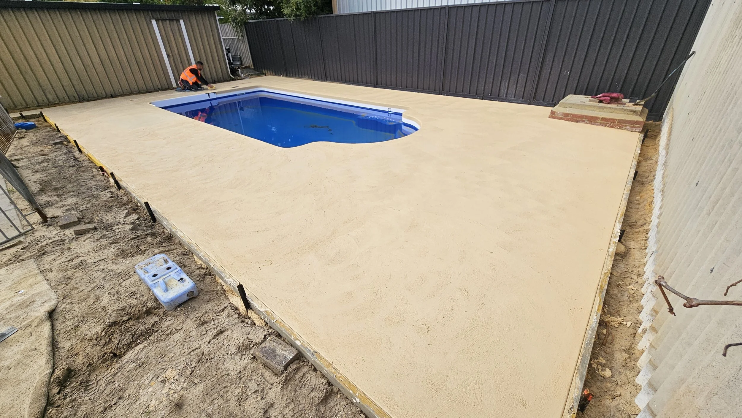Freshly poured liquid limestone to pool surrounds in Forrestfield