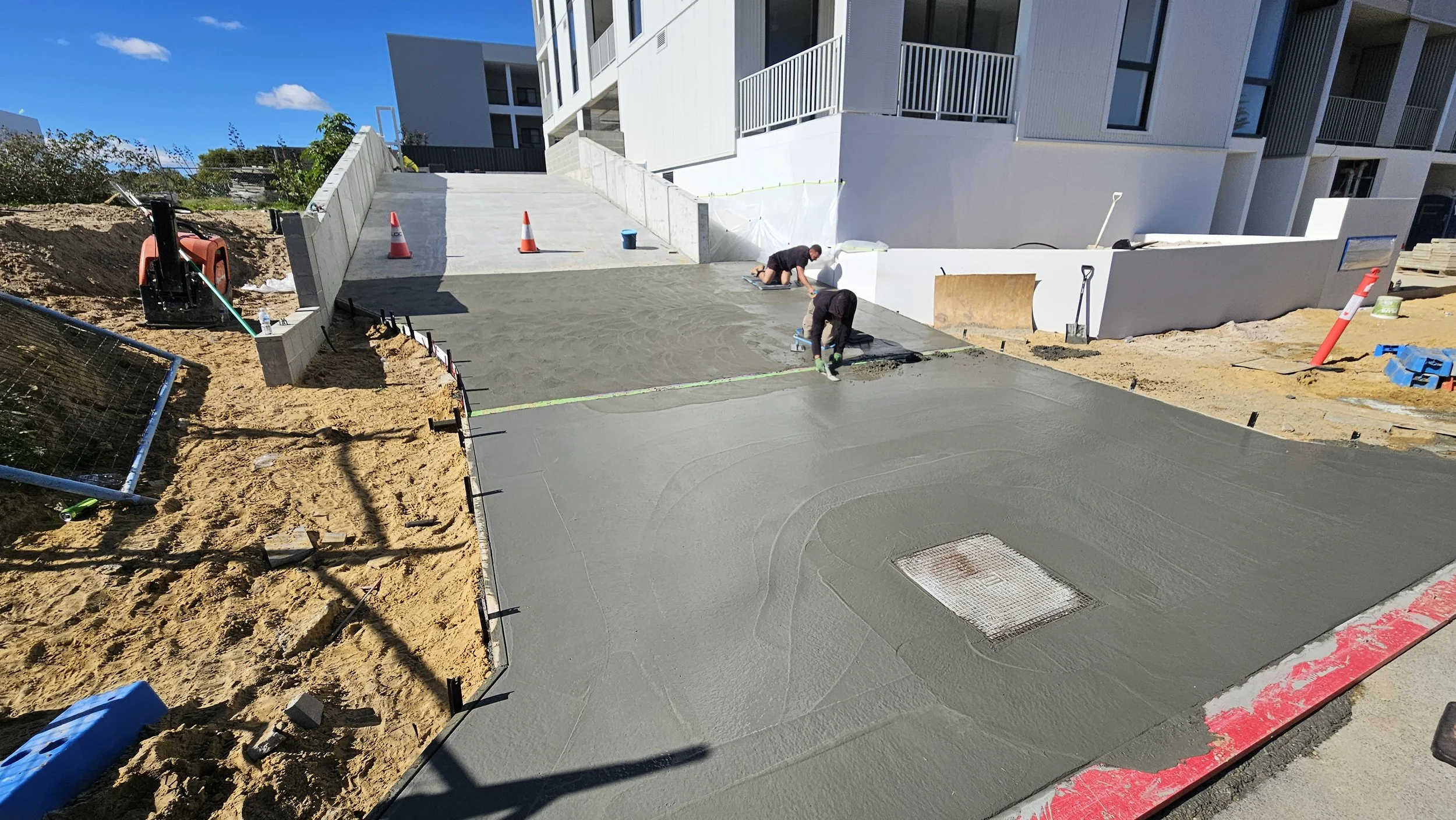 Grey concrete crossovers in North Coogee fresh pour