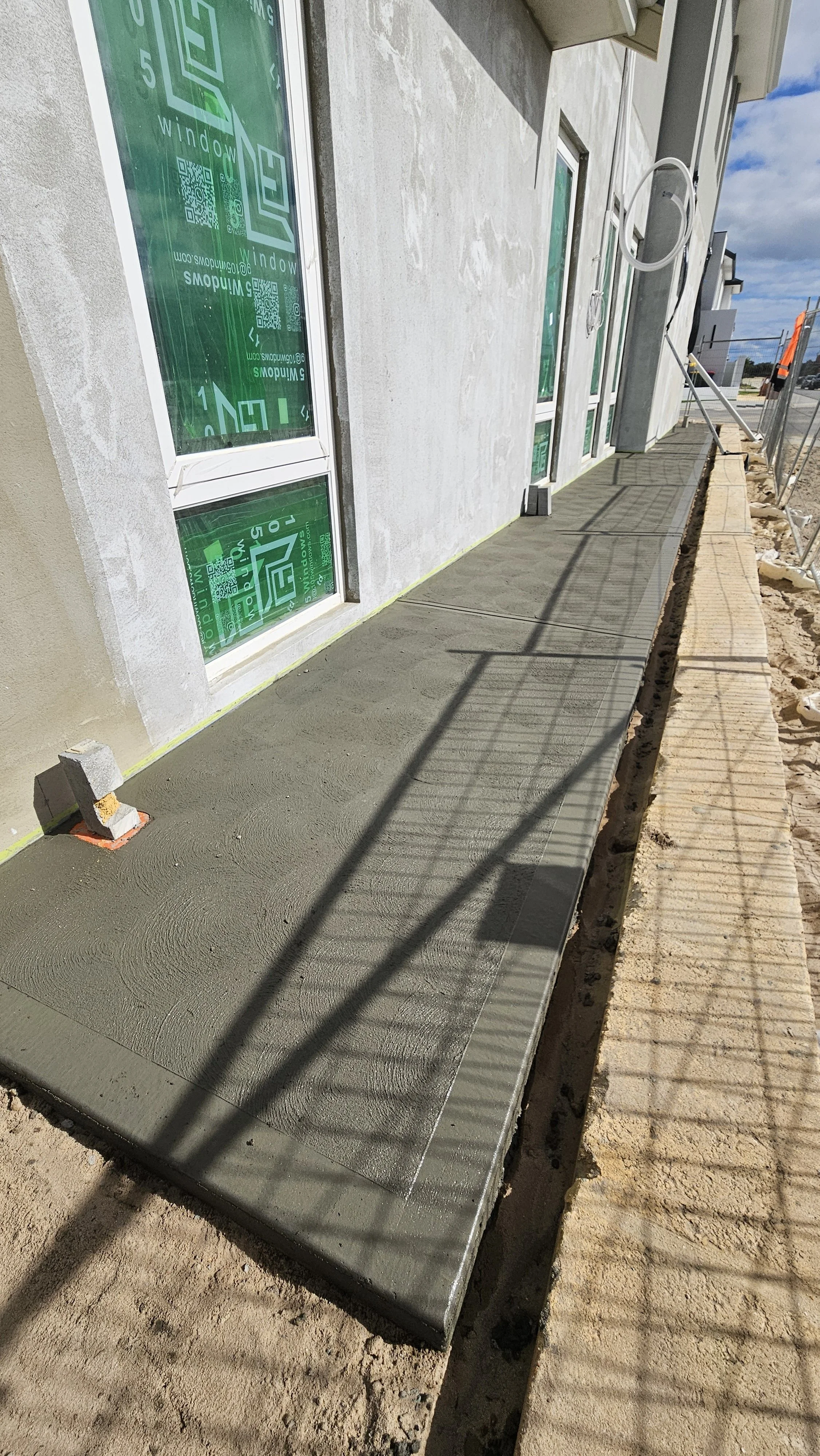 House grey concrete pathways surrounds in Treeby