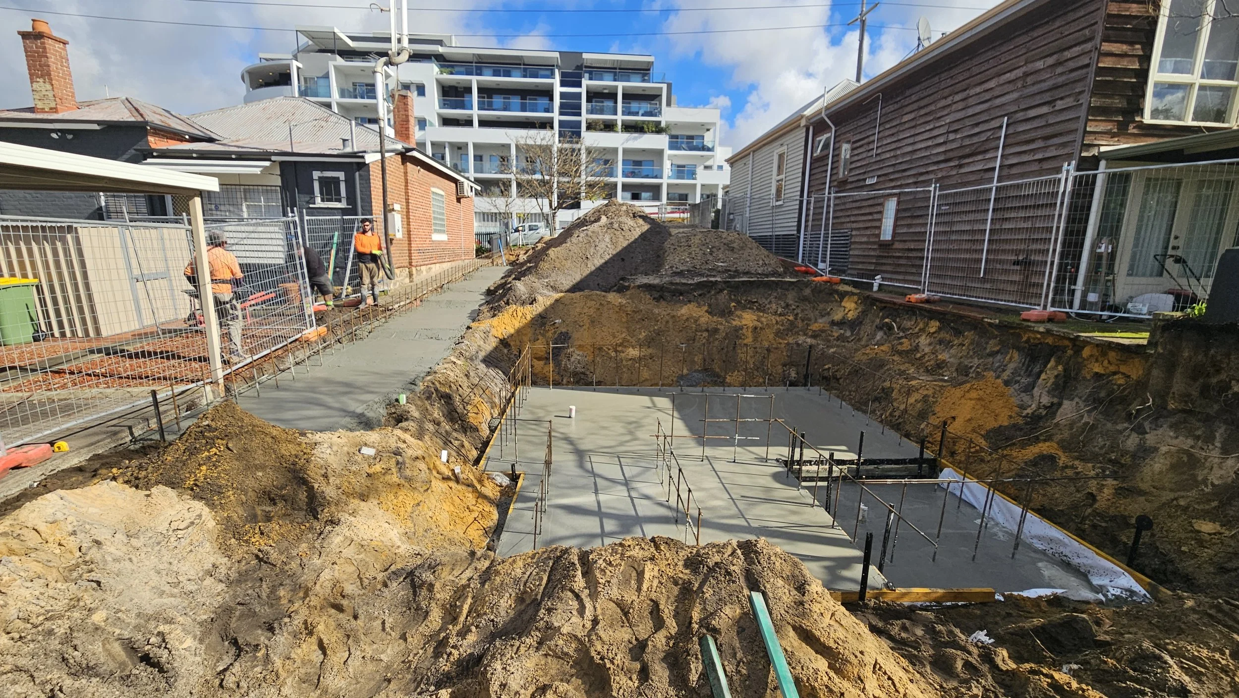 Undercroft slab and retaining wall grey concrete in West Leederville