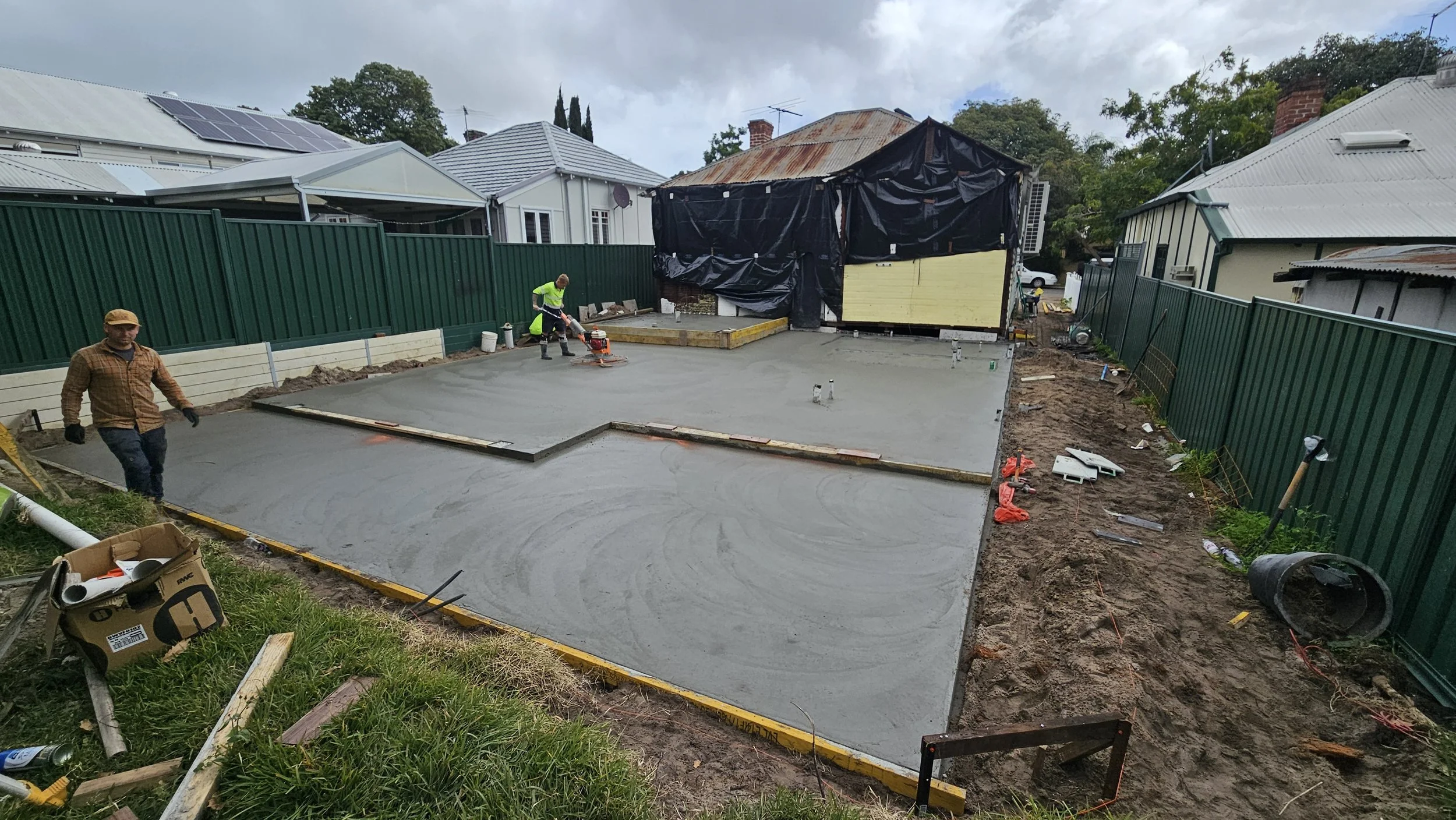 Freshley poured slab extension with trowell machine in Victoria Park