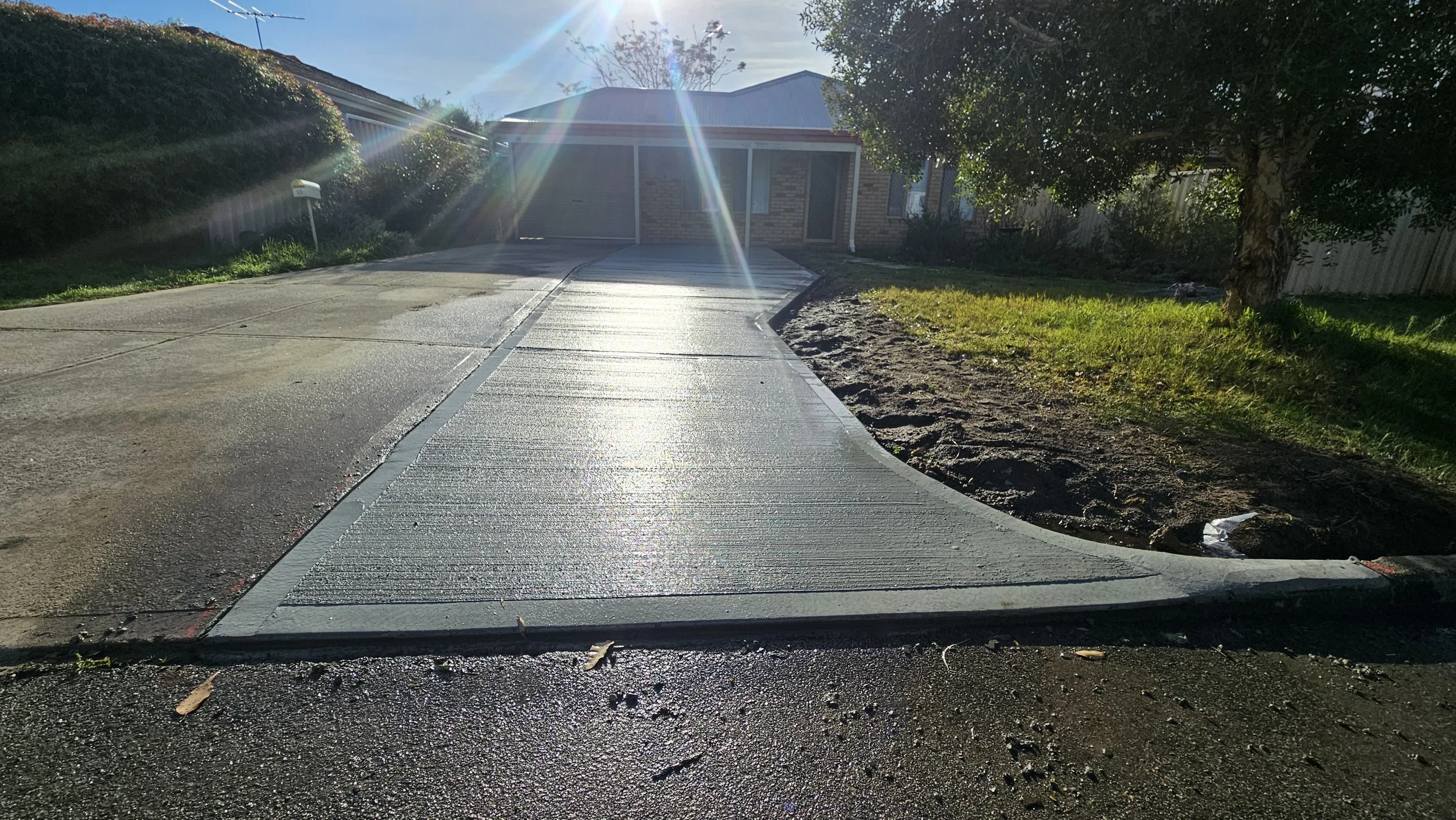Grey concrete driveway replacement in Ashfield